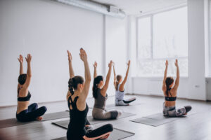 People doing yoga in a studio.