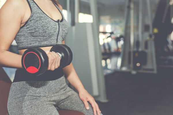 Woman lifting dumbbells