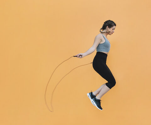 Girl jumping rope burning calories.