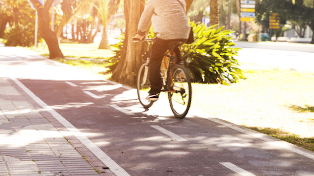 man riding bike to commute.