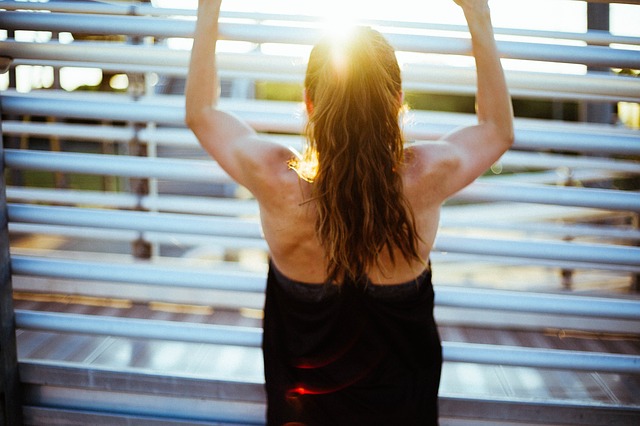 Woman working out at sunrise.