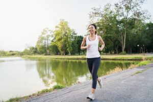 woman running on safe well lit path.