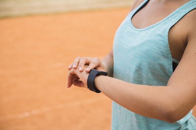 woman looking at her smart watch.