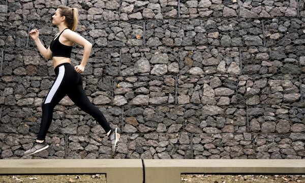 woman on long run in city.