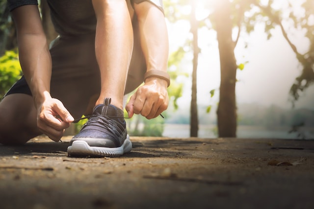 person tying their shoes ready for a run. 