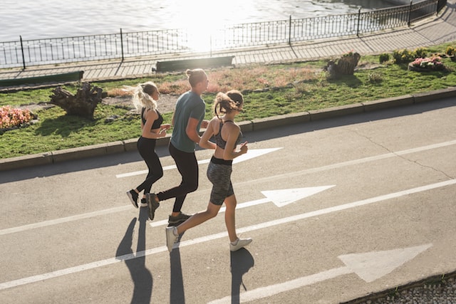 friends running together in street.