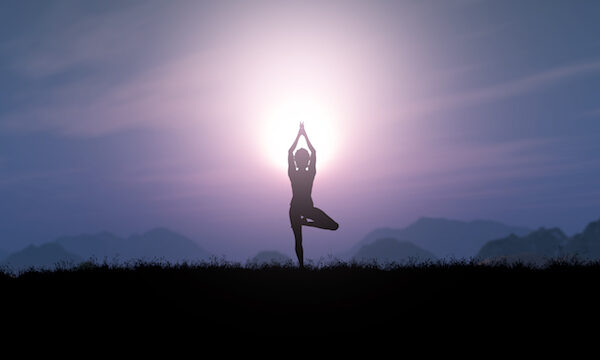 woman meditating at night